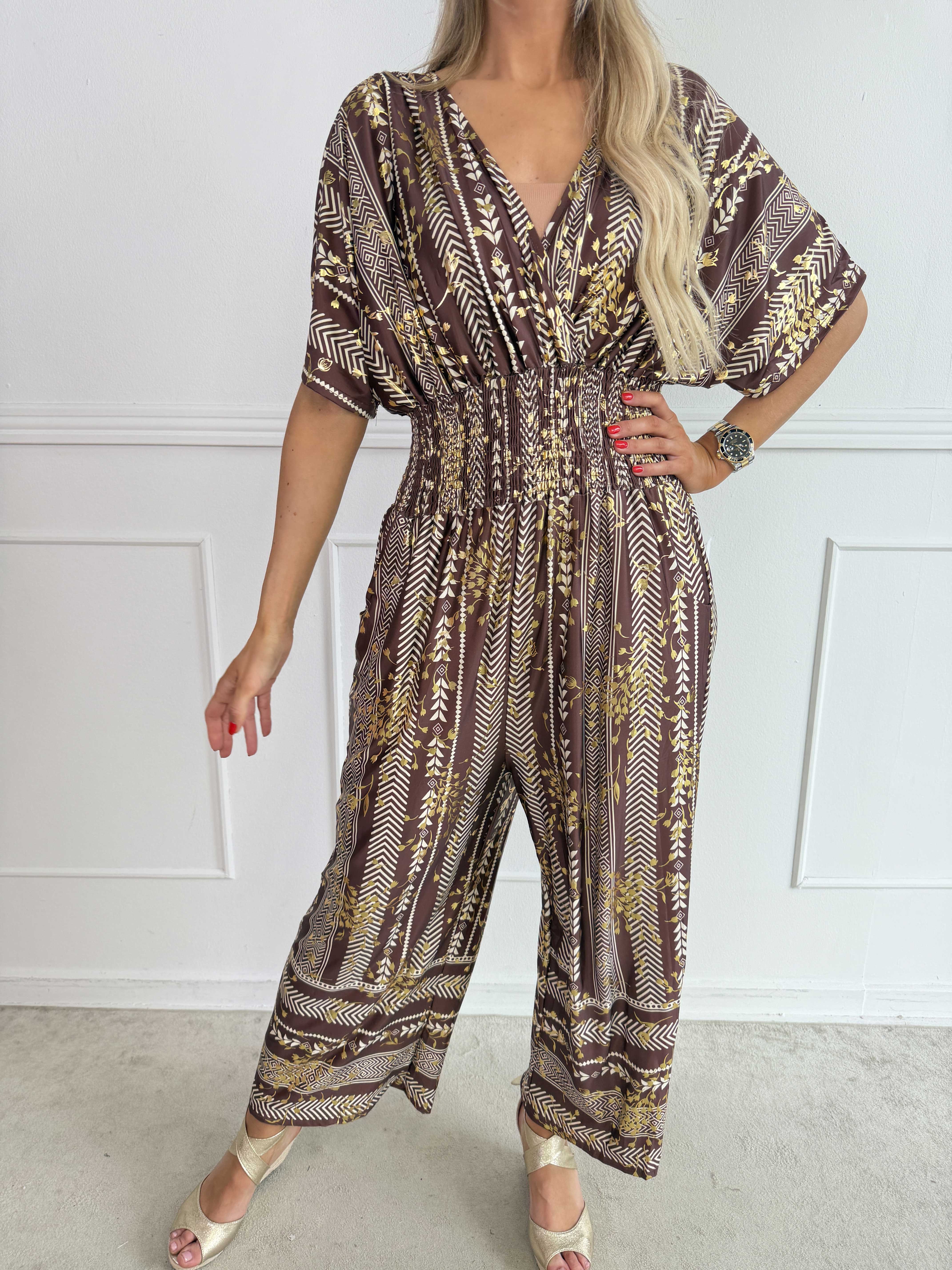 Pams Tribal Jumpsuit - Elastisk mønstret buksedragt med små guld blomster